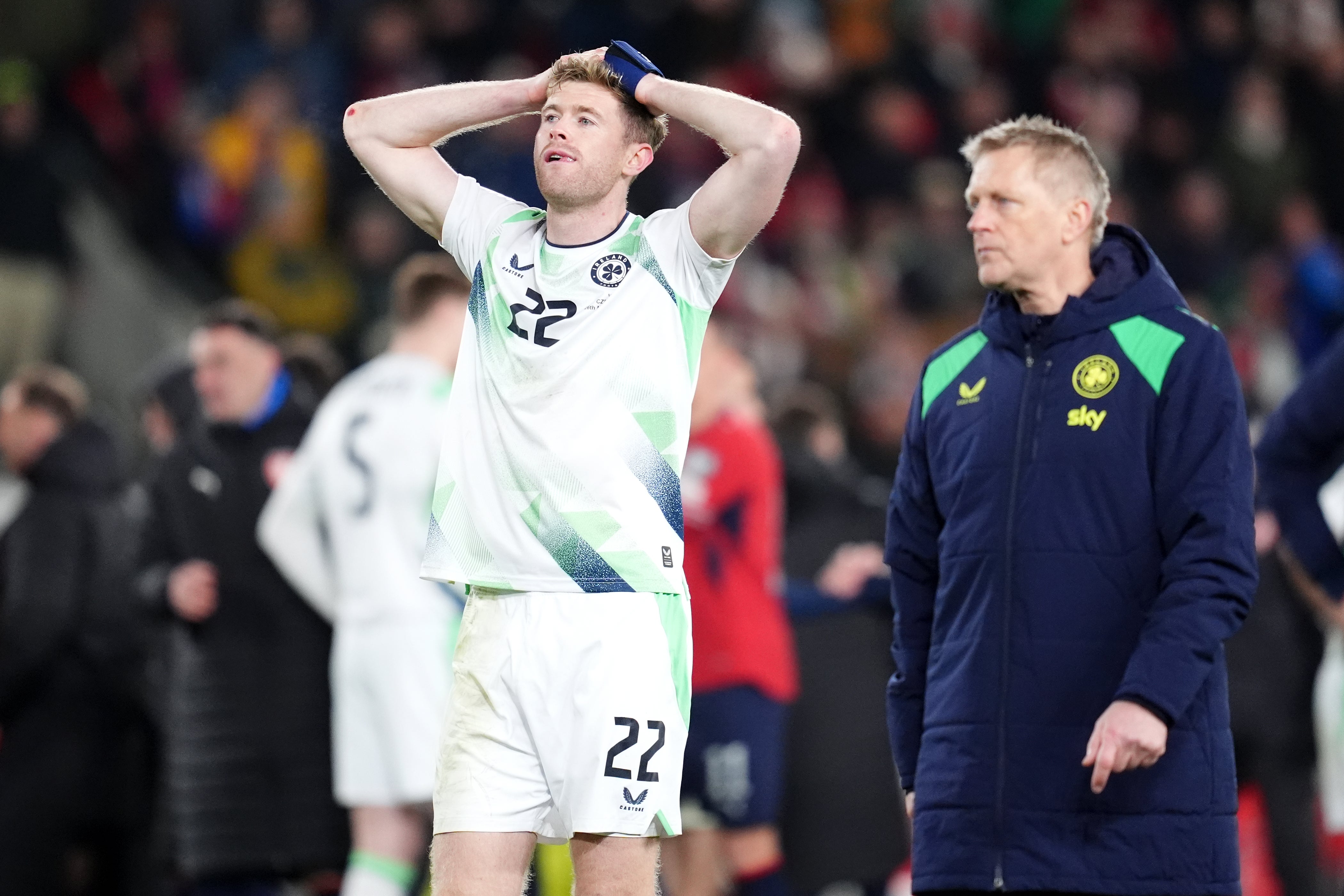 Nathan Collins (left) and head coach Heimir Hallgrimsson appear dejected following the penalty shoot-out defeat (Adam Davy/PA)