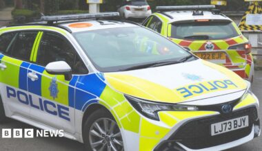 A police car parked in a car park.