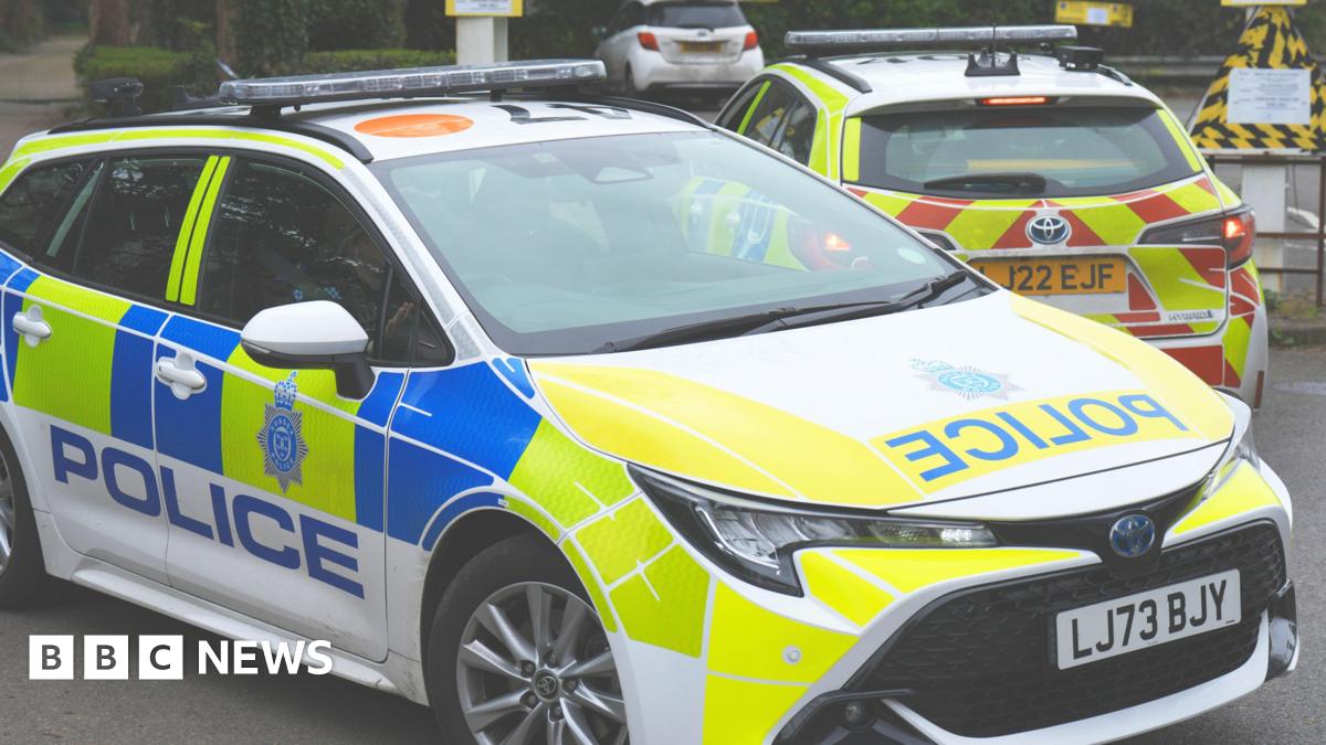 A police car parked in a car park.
