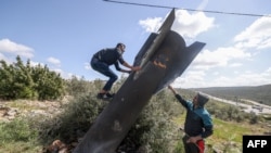 In Photos: Week Four Of The Iran War