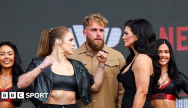 Ronda Rousey and Gina Carano face off either side of Jake Paul