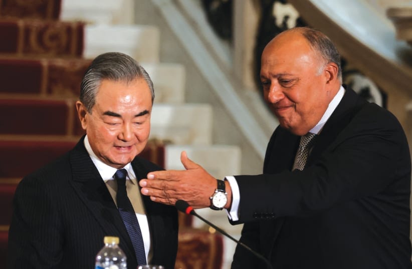  EGYPTIAN FOREIGN MINISTER Sameh Shoukry and Chinese Foreign Minister Wang Yi hold a news conference in Cairo last week. The Chinese foreign minister was mobilized to express his condemnation of the prospects of thousands of Palestinians pouring into Sinai, the writer notes.