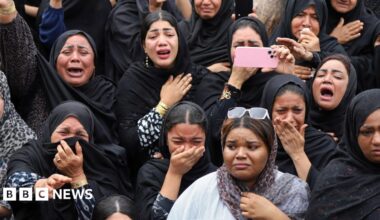 People looking for survivors in the rubble of the school in Minab