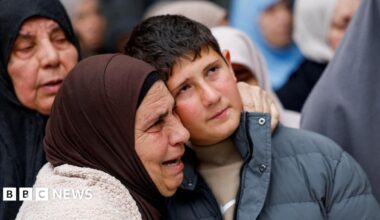 Khaled Bani Odeh is embraced by a woman during the funeral for his parents and two of his brothers in Tammun, in the Israeli-occupied West Bank (15 March 2026)