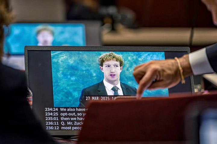 Lawyers for the plaintiff watch on a laptop as a recording of Meta Founder and CEO Mark Zuckerberg's deposition is played for the jurors on Wednesday, March 4, 2026, in Santa Fe, N.M. (Jim Weber/Santa Fe New Mexican via AP, Pool)