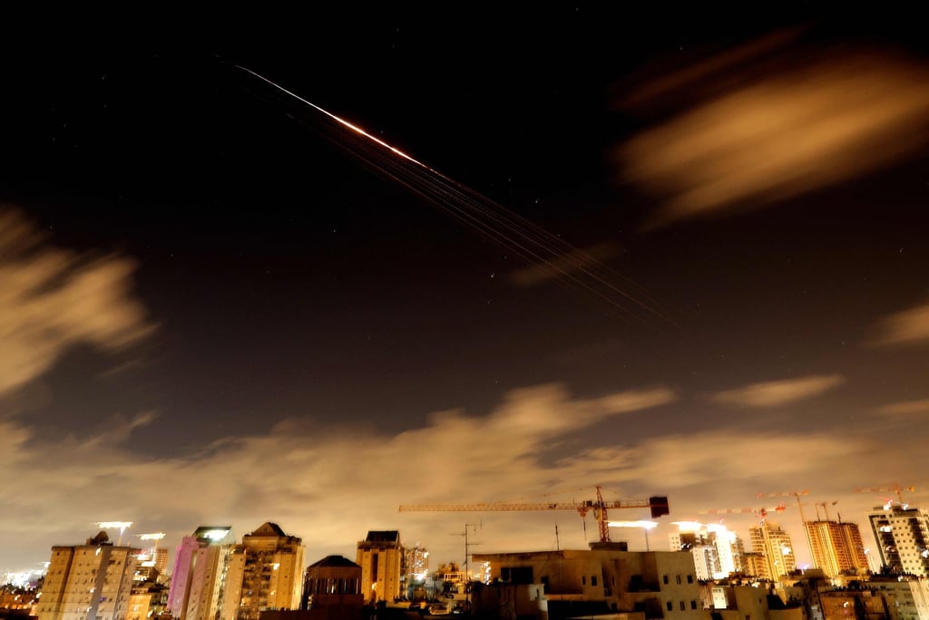 Rocket trails are seen in the sky amid a fresh barrage of Iranian missile attacks above the Israeli coastal city of Netanya. Photo: AFP