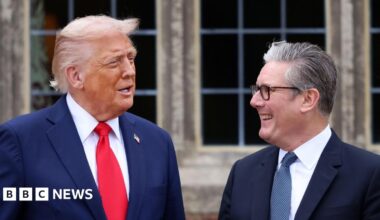 US President Donald Trump with British Prime Minister Sir Keir Starmer in September 2025. Trump wears a blue jacket, red tie and a gold pin featuring the American flag. Starmer wears a blue jacket, blue patterned tie and his customary black-rimmed glasses.
