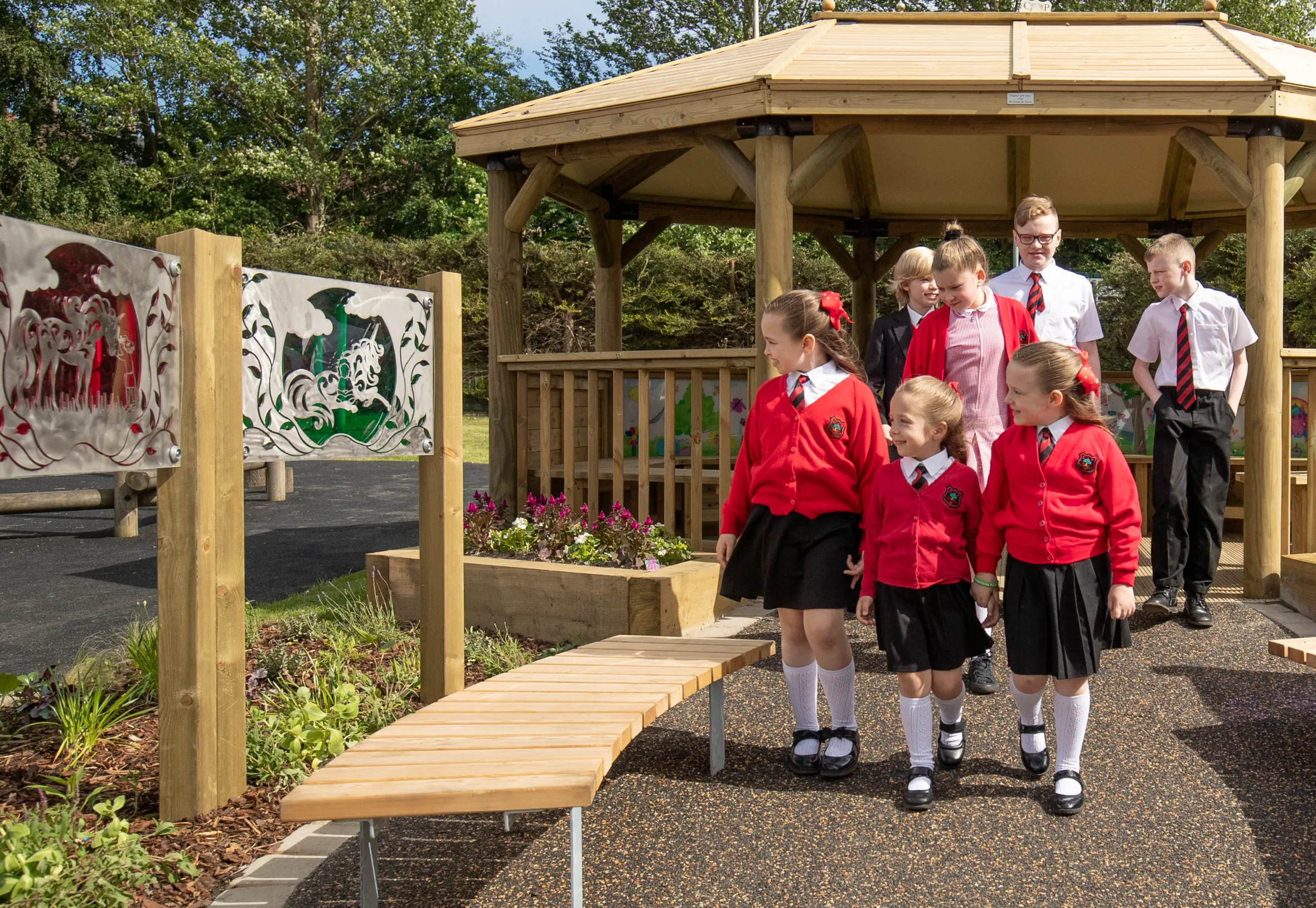 School children visiting a new play area and shelter dedicated to former pupil Alesha MacPhail.