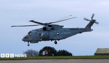 The Royal Navy Merlin Mk2 helicopter taking off from RNAS Culdrose on Saturday. It is on a concrete runway on a clear day.
