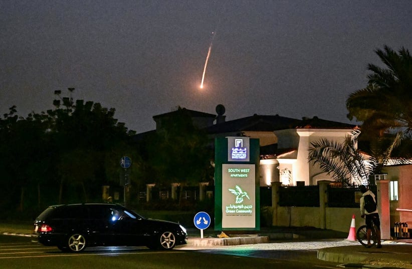 A projectile falls over Dubai on February 28, 2026. AFP correspondents heard a loud explosion in Dubai on February 28 and one of them saw a plume of smoke rising from the city. The explosions came in the wake of wide-ranging Iranian attacks on the Gulf, in retaliation for US and Israel strikes on Ir