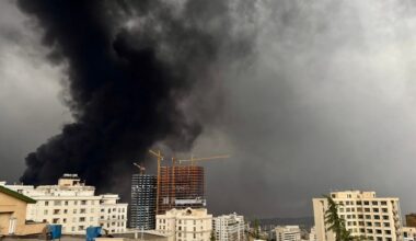A cleric is seen among models of centrifuges and Iranian missiles during the rally, on November 4, 2025, in Tehran, Iran.