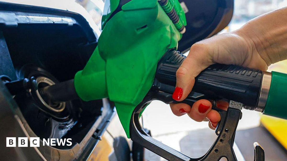 A motorist refuels a vehicle with unleaded petrol at a Jet petrol station, a subsidiary of Phillips 66, in Brentford, north west of London.