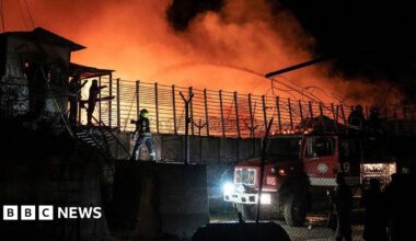 Firefighters douse water on a drug treatment centre that is on fire in Kabul, Afghanistan during the night