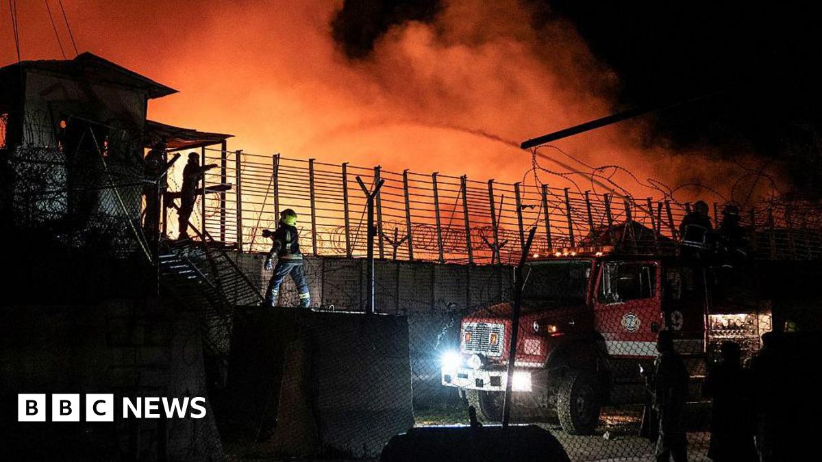 Firefighters douse water on a drug treatment centre that is on fire in Kabul, Afghanistan during the night