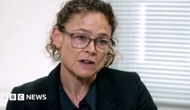 Kyran Smith, a man with black curly hair and a dark moustache, is pictured in a police mugshot.