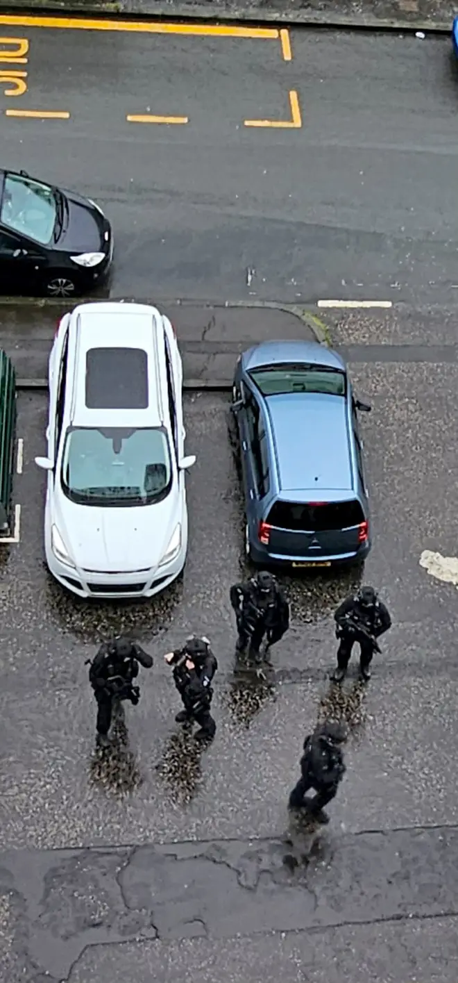 armed police officers in Calder, Edinburgh, following "reports of a man with a bladed weapon"