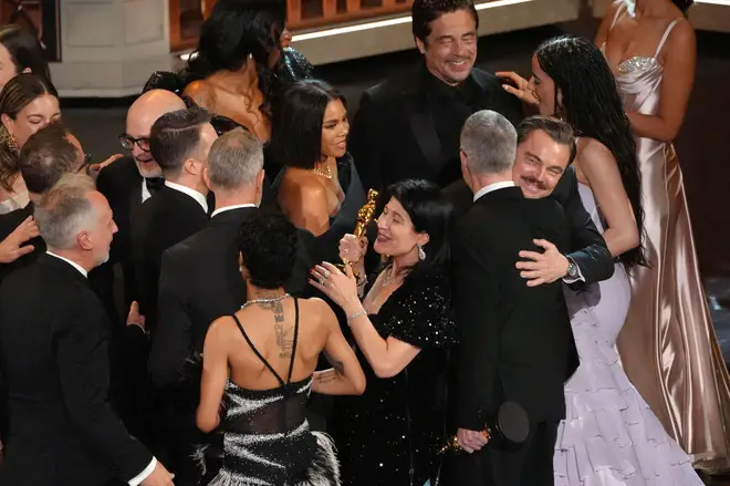 The team from "One Battle After Another" celebrate winning the award for best picture during the Oscars on Sunday, March 15, 2026, at the Dolby Theatre in Los Angeles.
