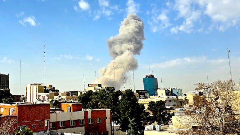 A plume of smoke rises after an explosion on February 28, 2026 in Tehran, Iran. After explosions were seen in the Iranian capital, the office of the Israeli Defense Minister issued a statement saying it had launched a preemptive strike against the country.
