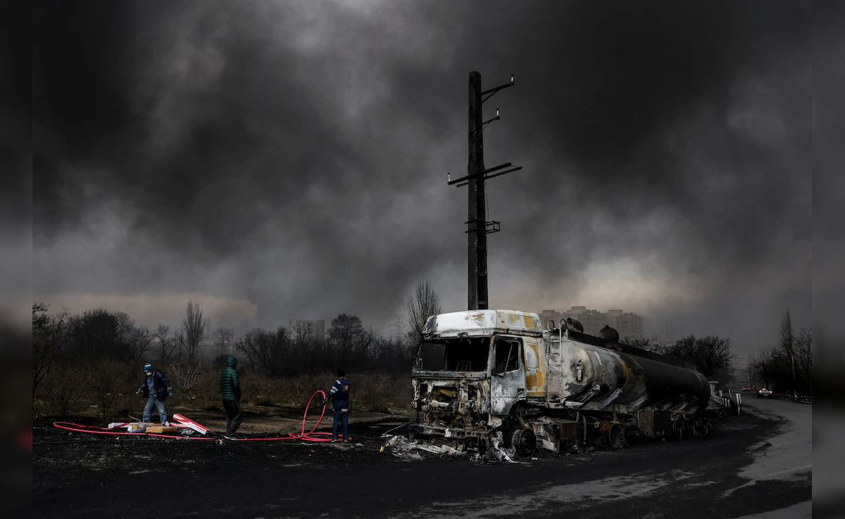 Smoke rises after a strike on Shahran fuel tanks in Tehran on Saturday. (Reuters)