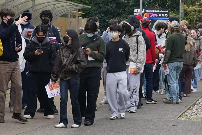 Students queuing to receive vaccines and antibiotics at the University of Kent campus in Canterbury