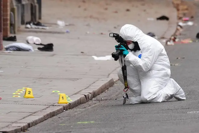 A forensic investigator at the scene in Friar Gate, Derby, where a number of people had been injured, some of them seriously, but not life-threatening, after being hit by a car in the city centre on Saturday night