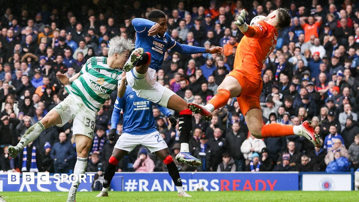 Celtic's Daizen Maeda headers the ball off Rangers defender Dujon Sterling's arm