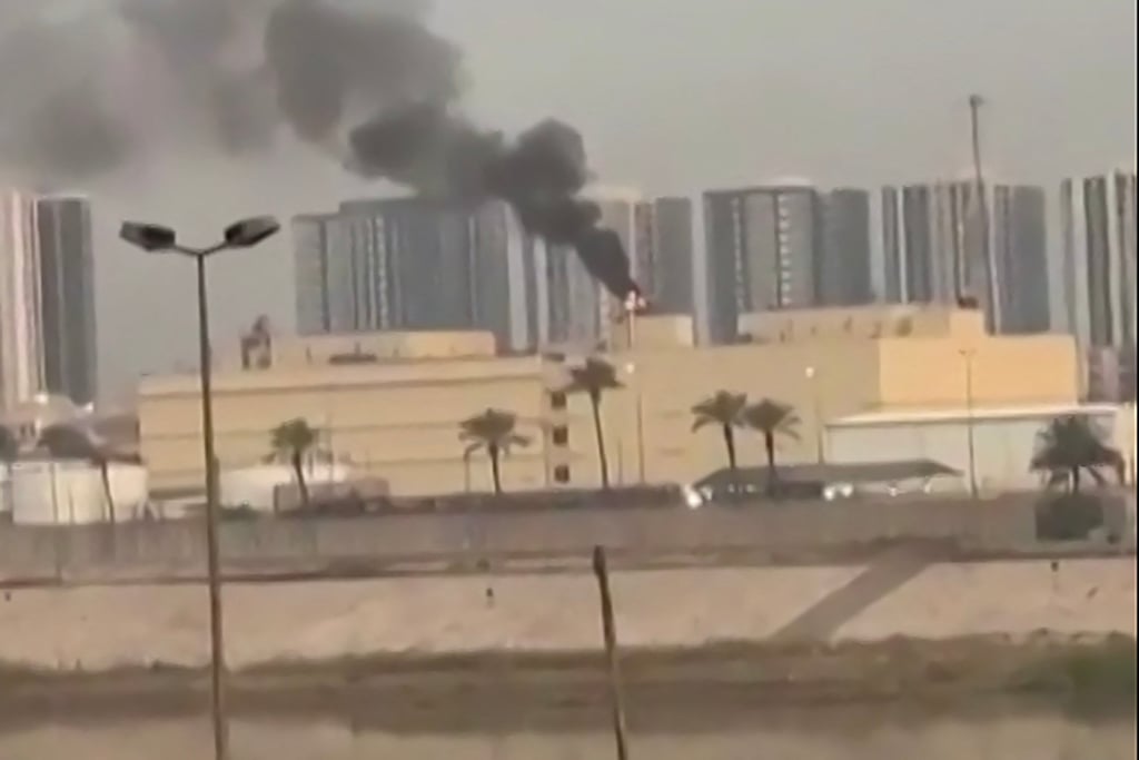A video grab shows smoke billowing from the US embassy in Baghdad’s fortified “Green Zone” following a reported drone strike on Saturday. Photo: various sources / AFP