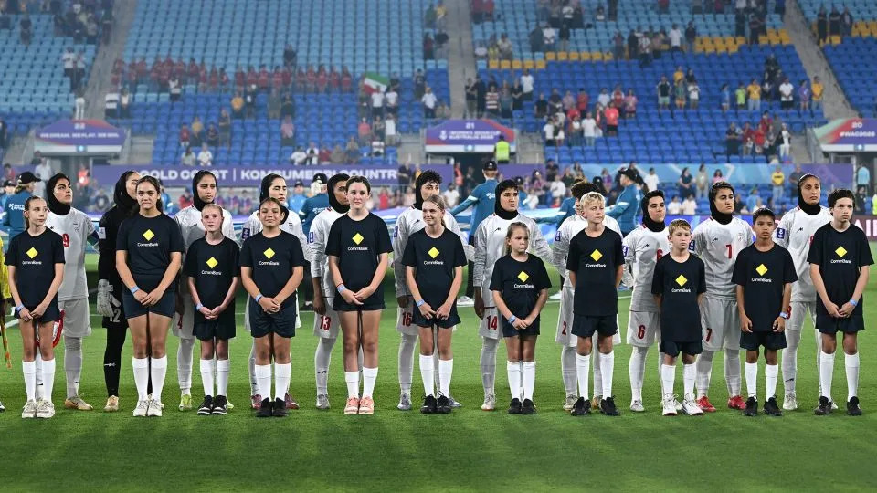 Iran players standing silent during anthems ahead of their opener against South Korea on March 2. - Albert Perez/Getty Images