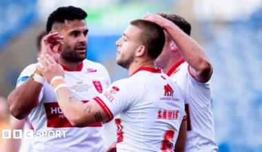 Two Hull KR players congratulate Mikey Lewis (LEWIS - 6) upon scoring a try against Huddersfield