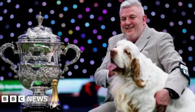 Owner Lee Cox sitting with Bruin and the trophy