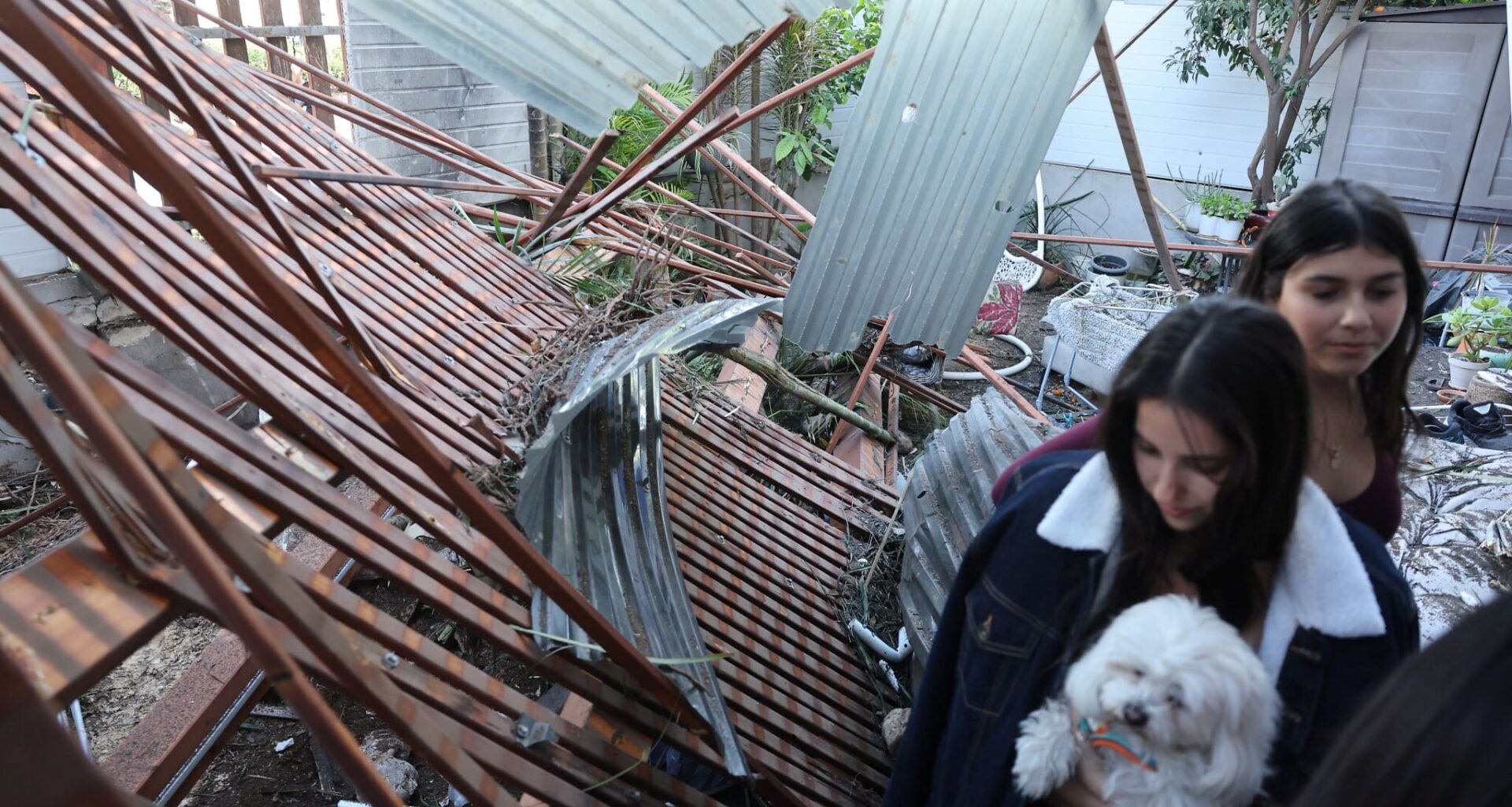 Damage but no injuries as Iranian cluster bomb fragments impact in central Israel