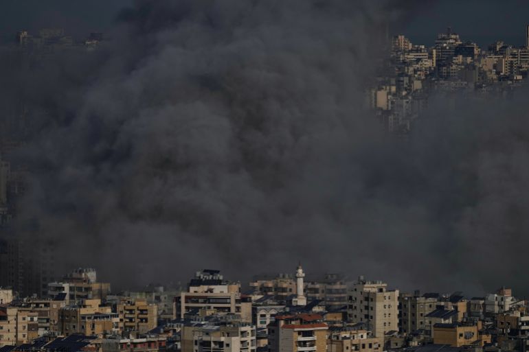 Smoke rises following an Israeli airstrike in Dahiyeh