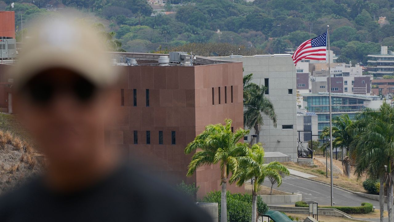 An American flag flies again at the US Embassy in Caracas, Venezuela, Saturday, March 14, 2026, seven years after it was lowered when Washington and Caracas cut diplomatic relations in 2019. (AP Photo/Ariana Cubillos)