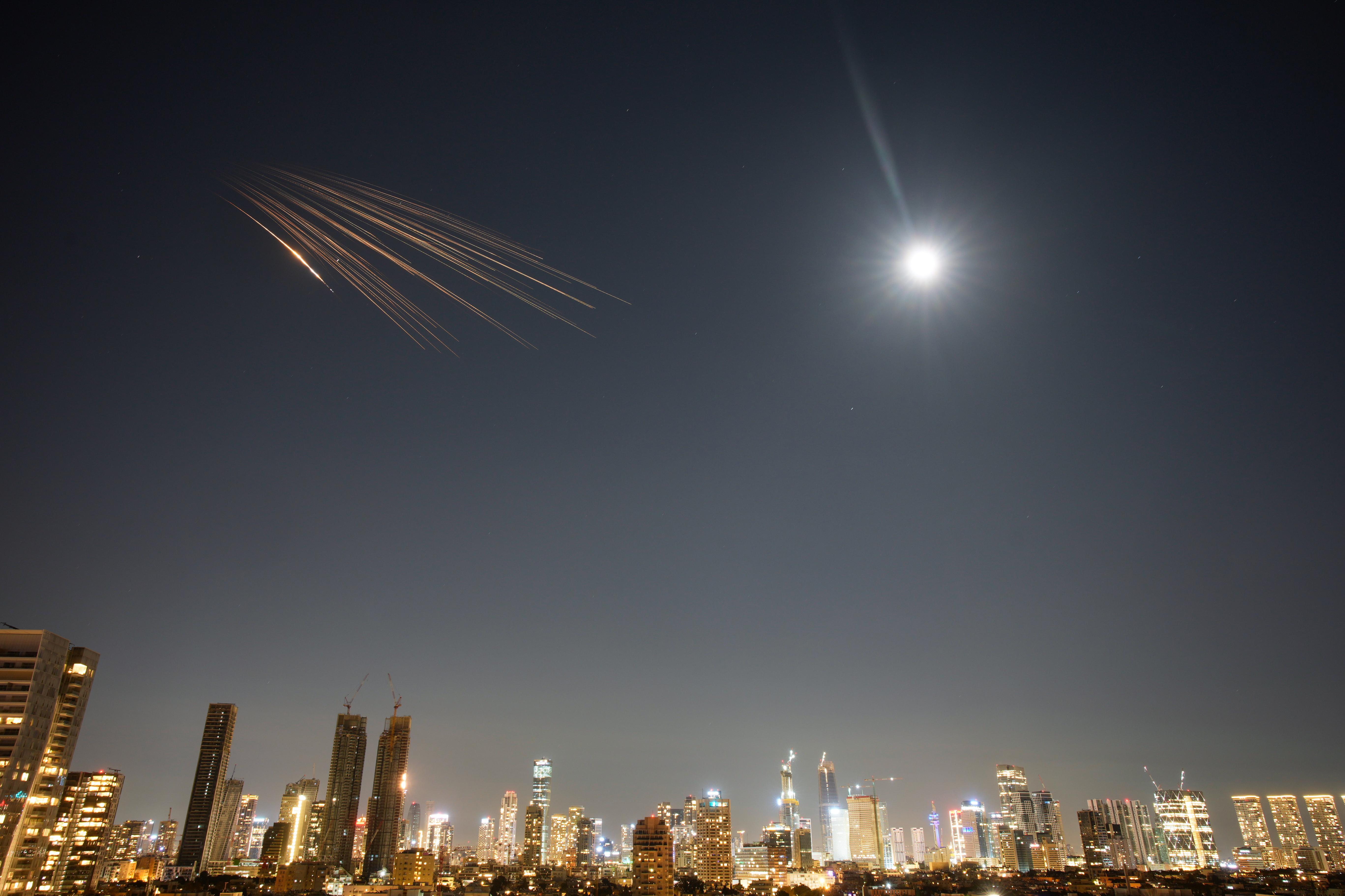 Missiles launched from Iran are seen in the sky over central Israel.