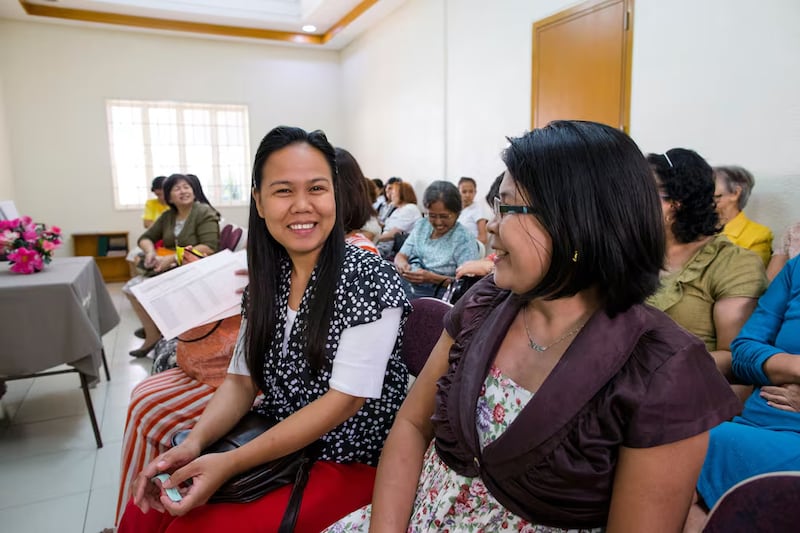 Women in the Philippines meet together in Relief Society.
