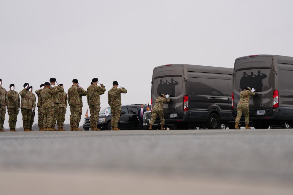 Door attendants U.S. Air Force Master Sgt. Christina Jiminez and Senior Airman Awng Dingrin...