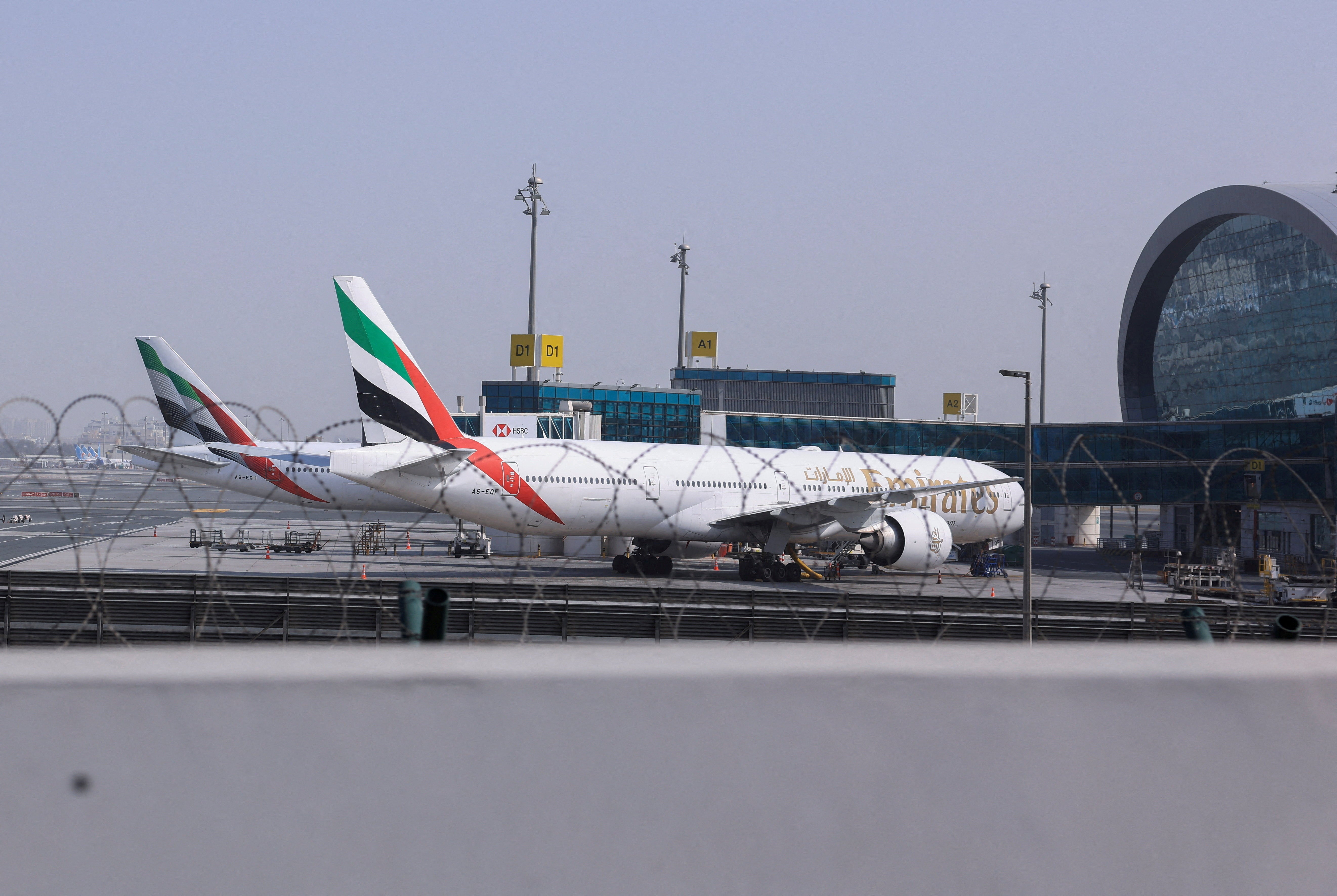 File: Planes are parked at terminal three of the Dubai international airport