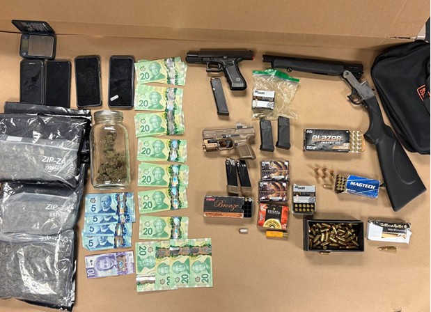 Toronto man facing 22 charges after police find guns, ammo, marijuana and cash at Sheppard and Weston address