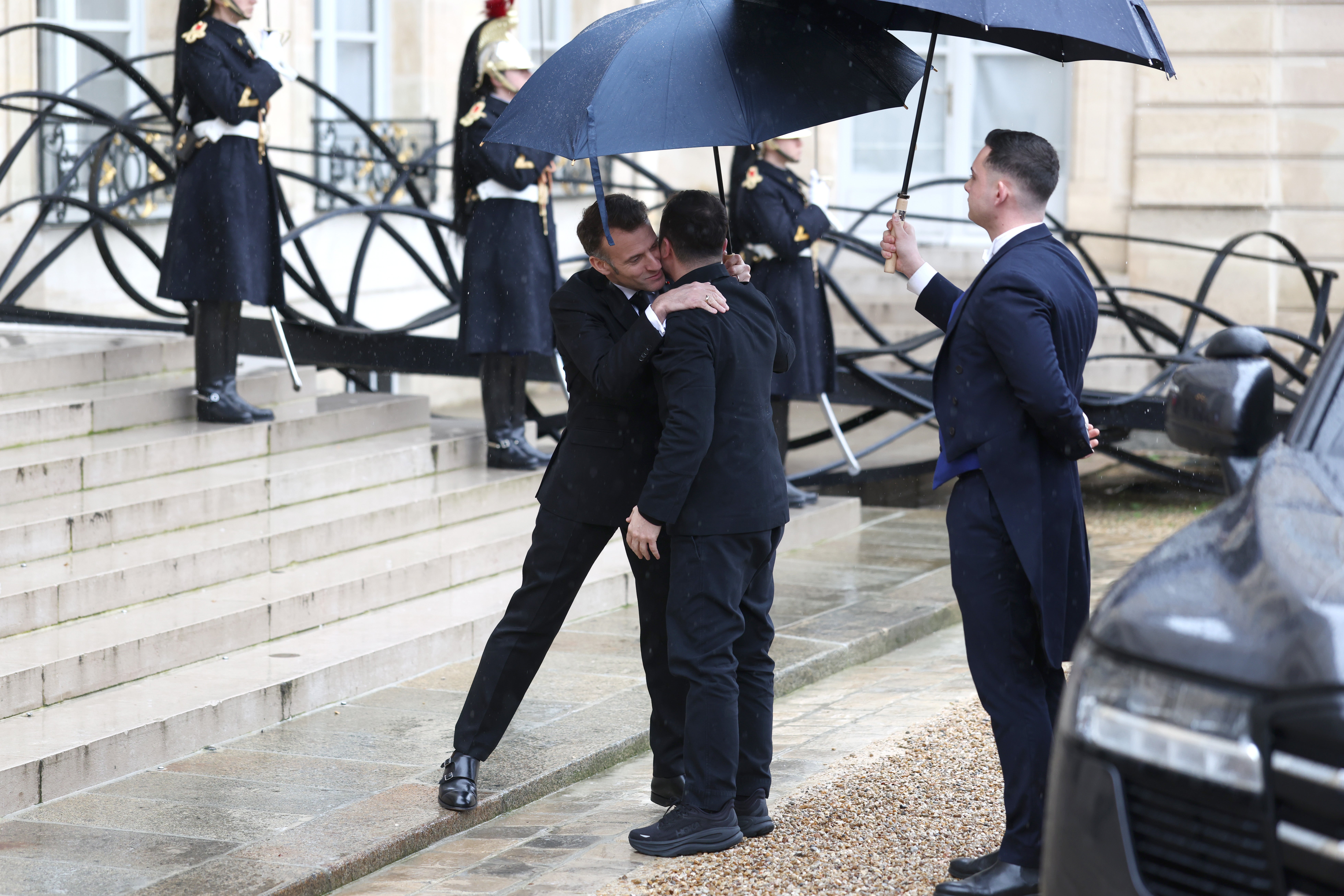 Macron and Zelensky embraced in front of the cameras as they met in Paris to discuss the war on Friday
