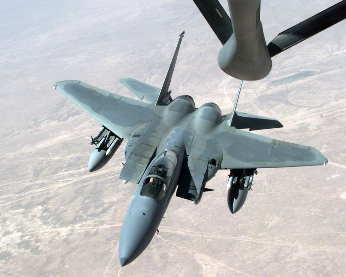 An Air Force F-15Cs from the Pacific Air Forces pulls into position beneath a KC-135 Strato-tanker to refuel while flying near the Iraqi border during a routine patrol mission of the Southern Watch No-Fly January 5, 1999. Earlier four U.S. Air Force and Navy jets fired on and missed four Iraqi MiGs testing the no-fly zone over southern Iraq. It was the first such air confrontation in more than six years. (photo by Vincent Parker/USAF)