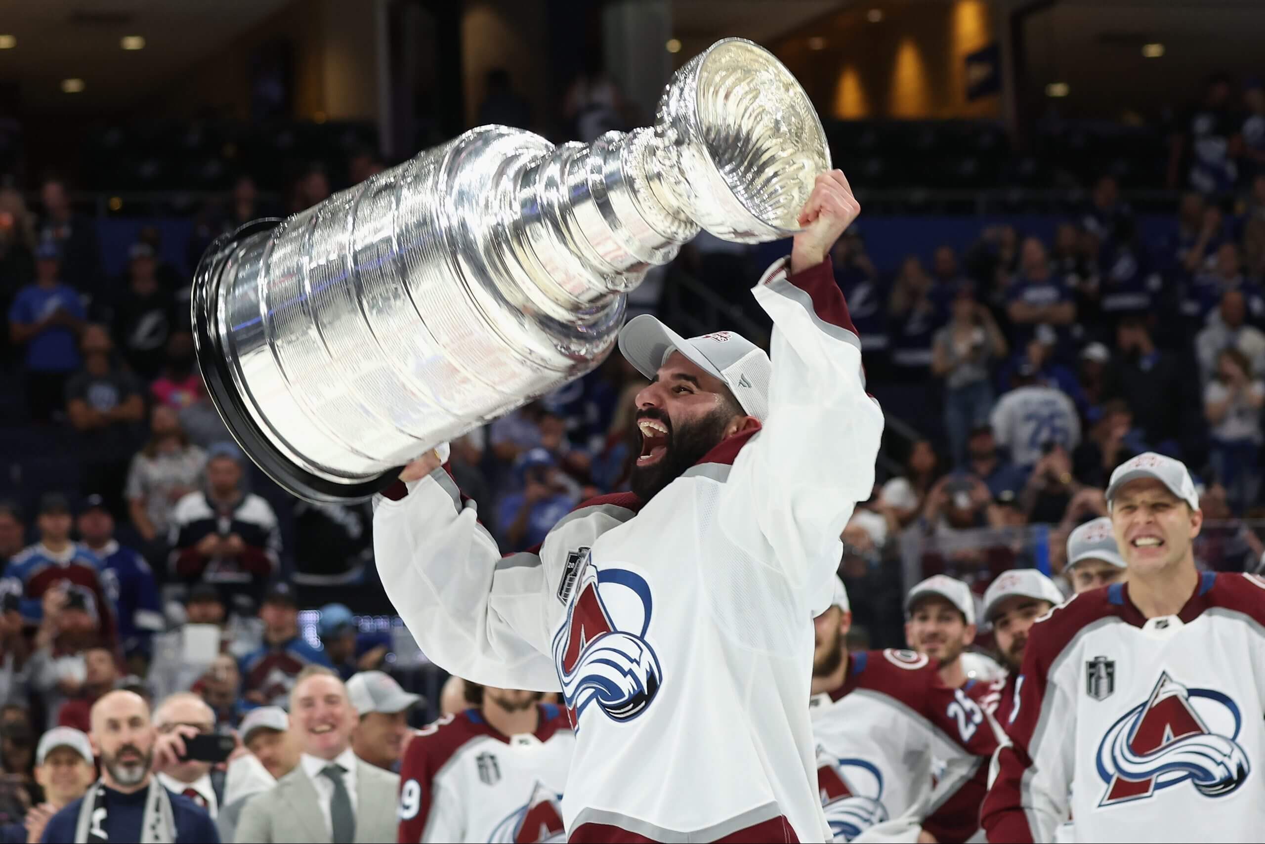 Nazem Kadri lifts the Stanley Cup over his head with the Avalanche.