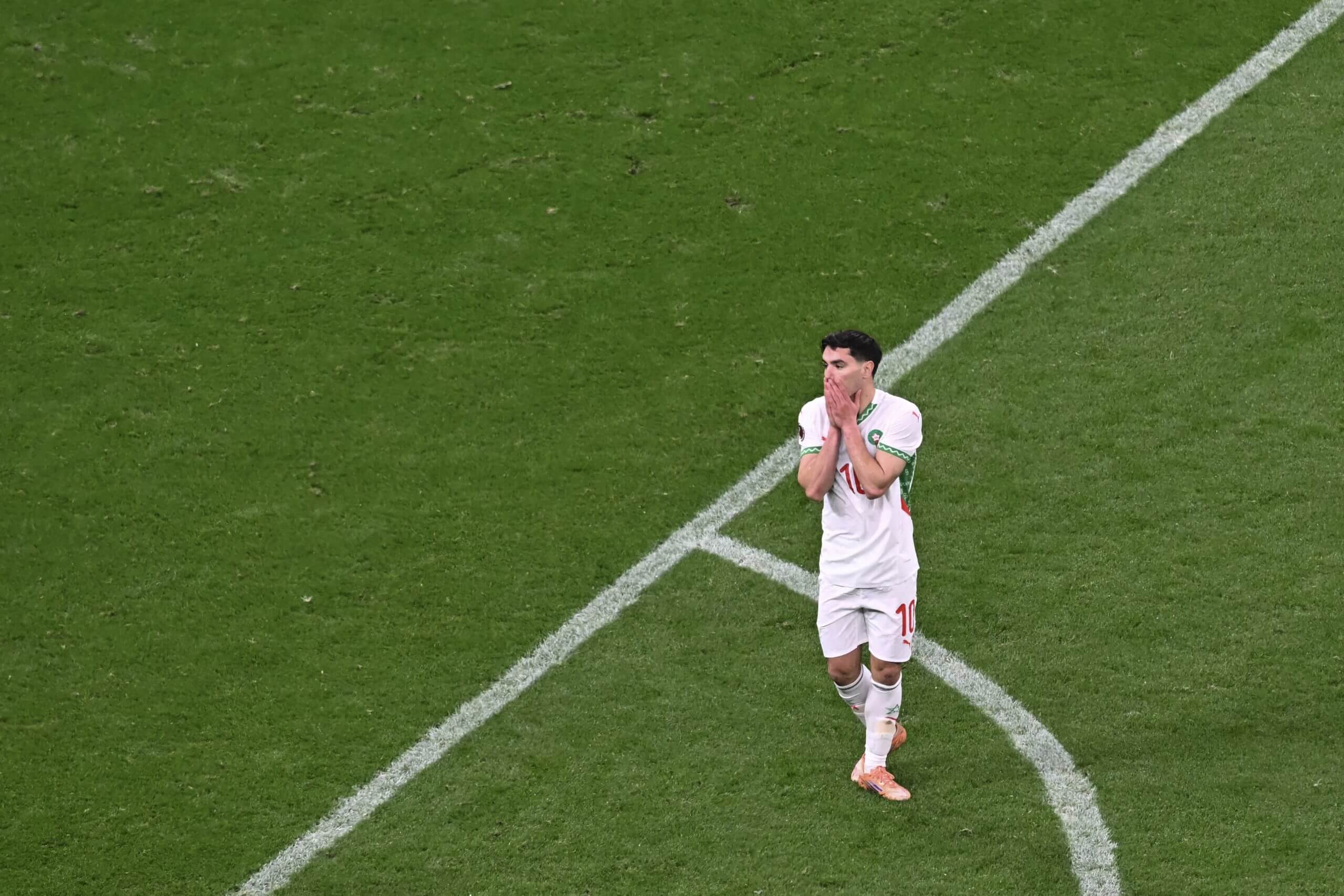 Morocco's Diaz with his hands on his face after missing his penalty