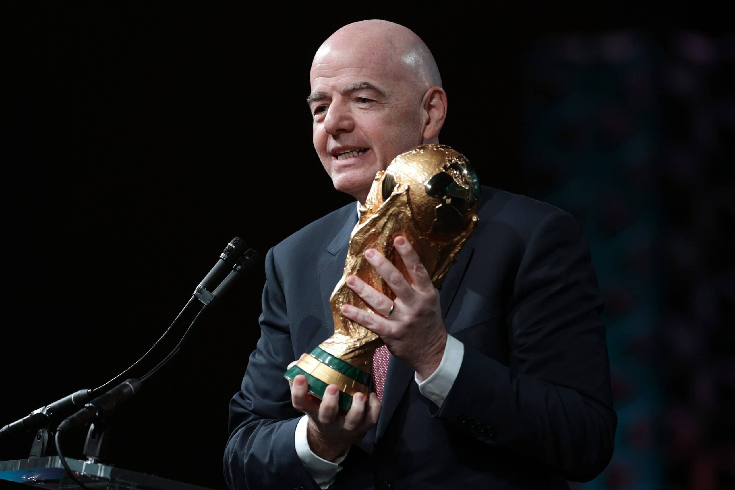 Infantino holding the World Cup