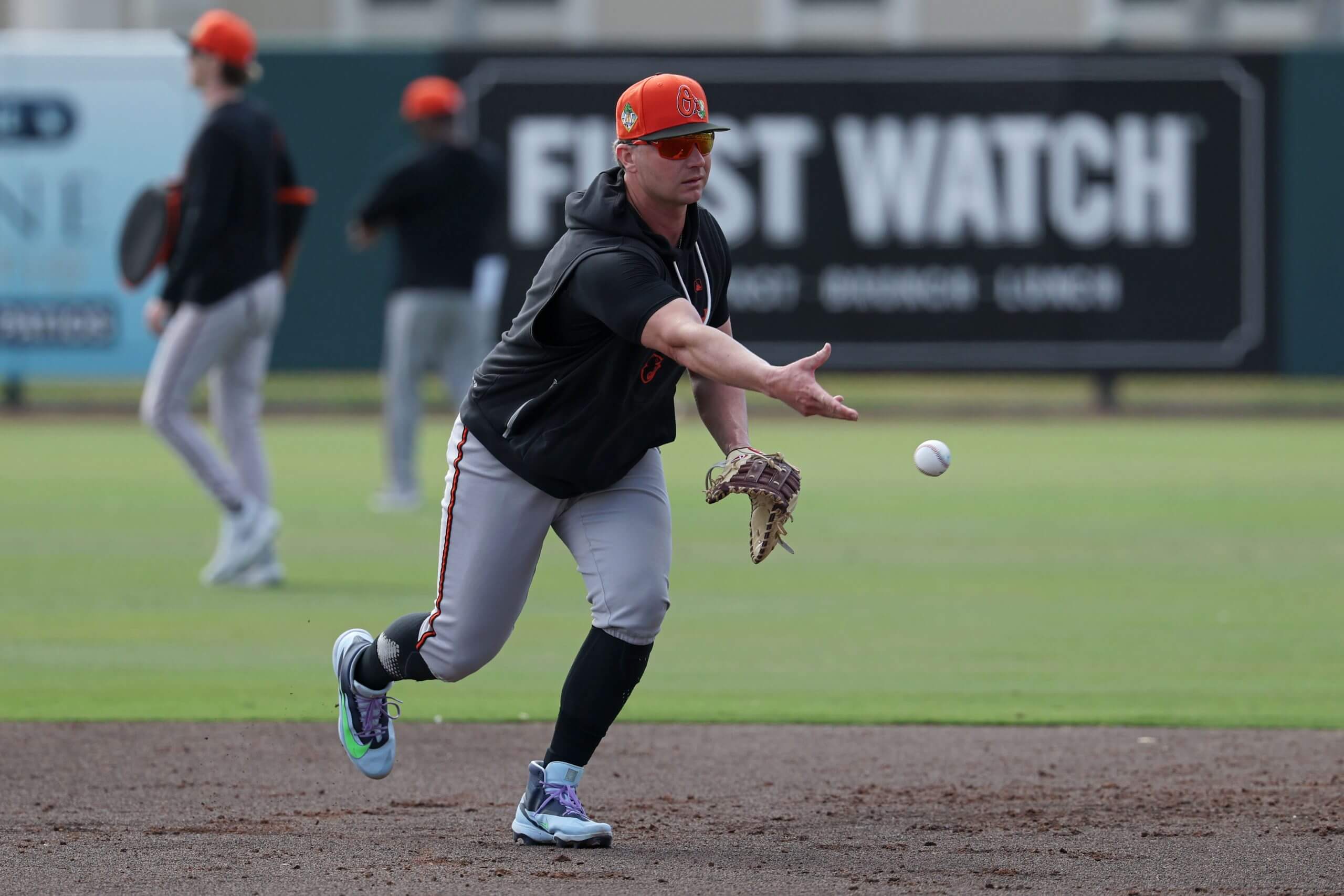 Pete Alonso #25 of the Baltimore Orioles throws the ball during practice at Ed Smith Stadium on February 16, 2026 in Sarasota, Florida. 