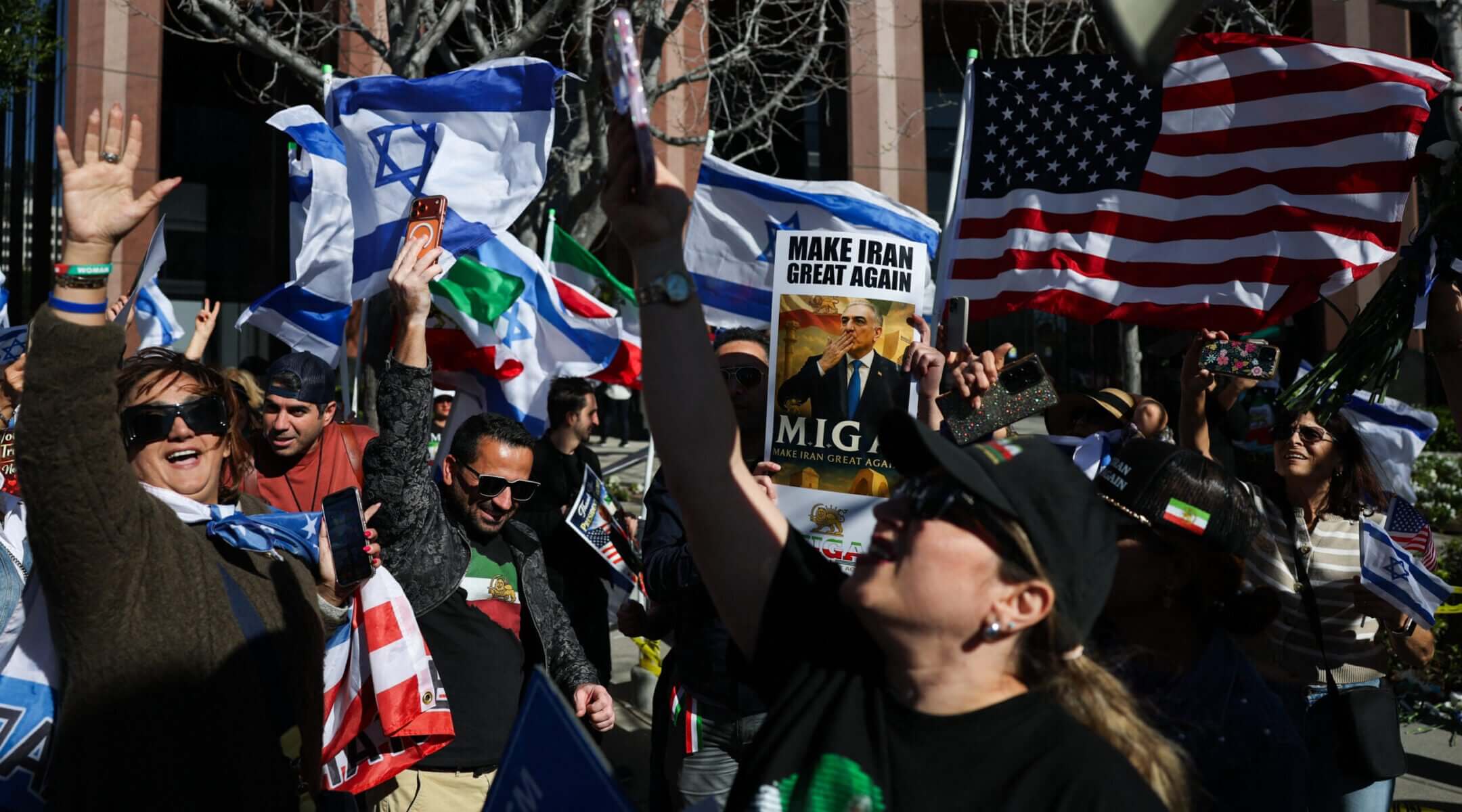 Iranian Americans wave flags and chant during a gathering of Iranian community members showing support for Israel and the United States, outside the Consulate General of Israel in Los Angeles, on March 5, 2026.