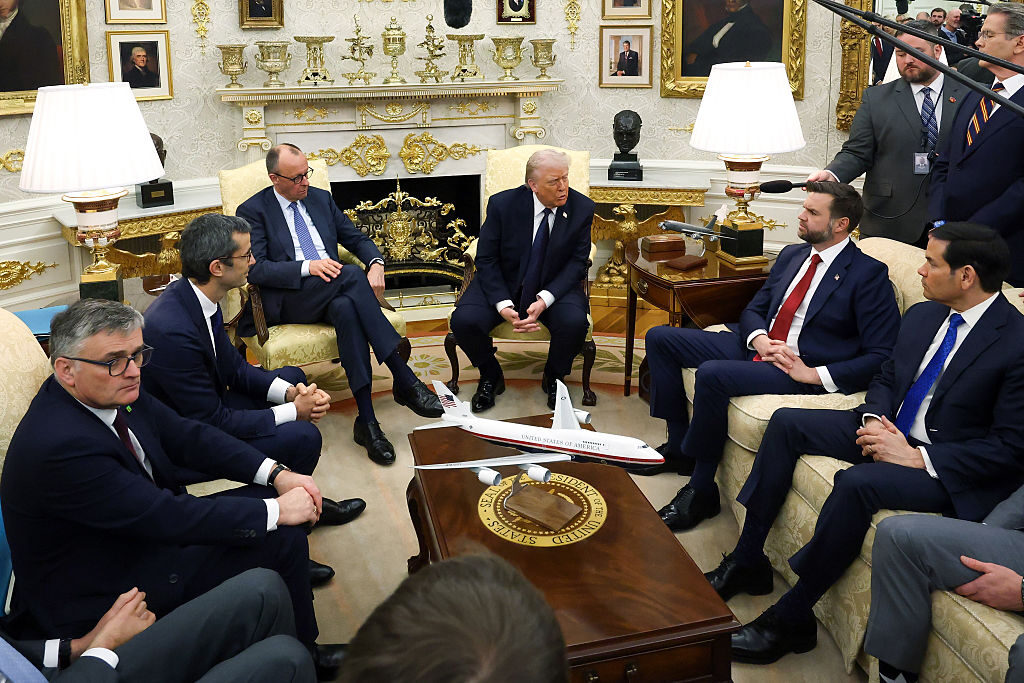 President Donald Trump and German Chancellor Friedrich Merz address reporters in the Oval Office on Tuesday.