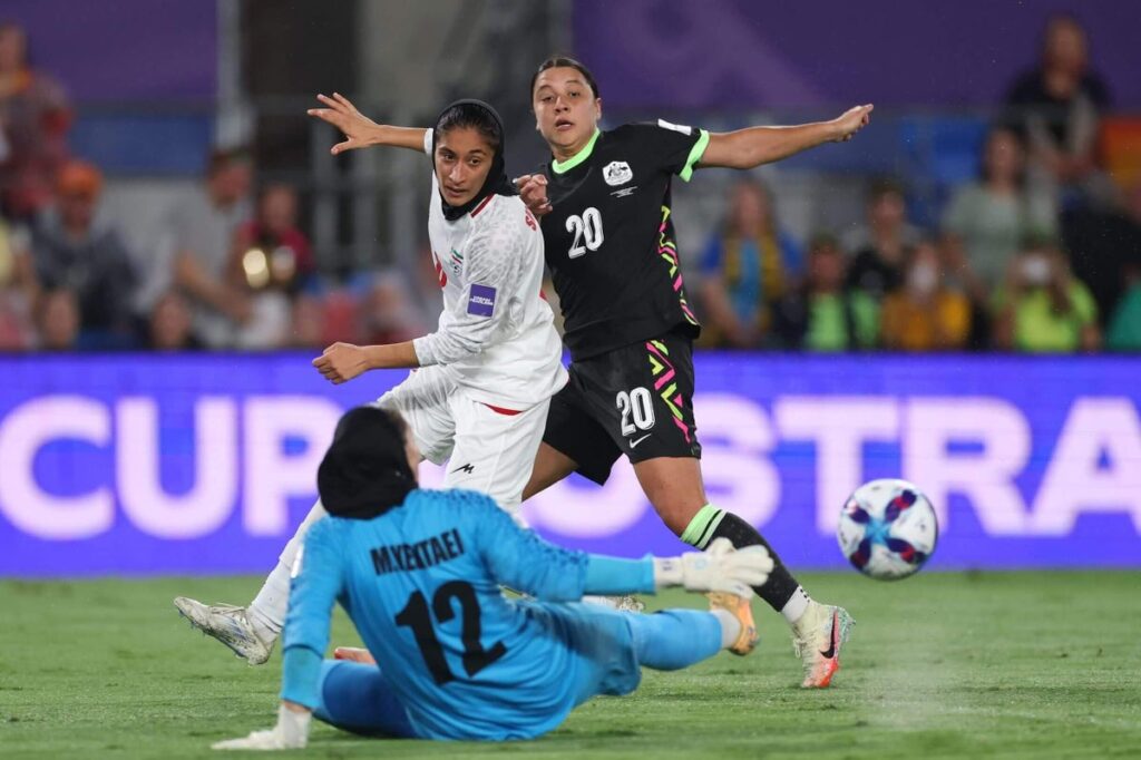 Australia's Sam Kerr scores past Iran's Shabnam Behesht and Maryam Yektaei, though it was later disallowed