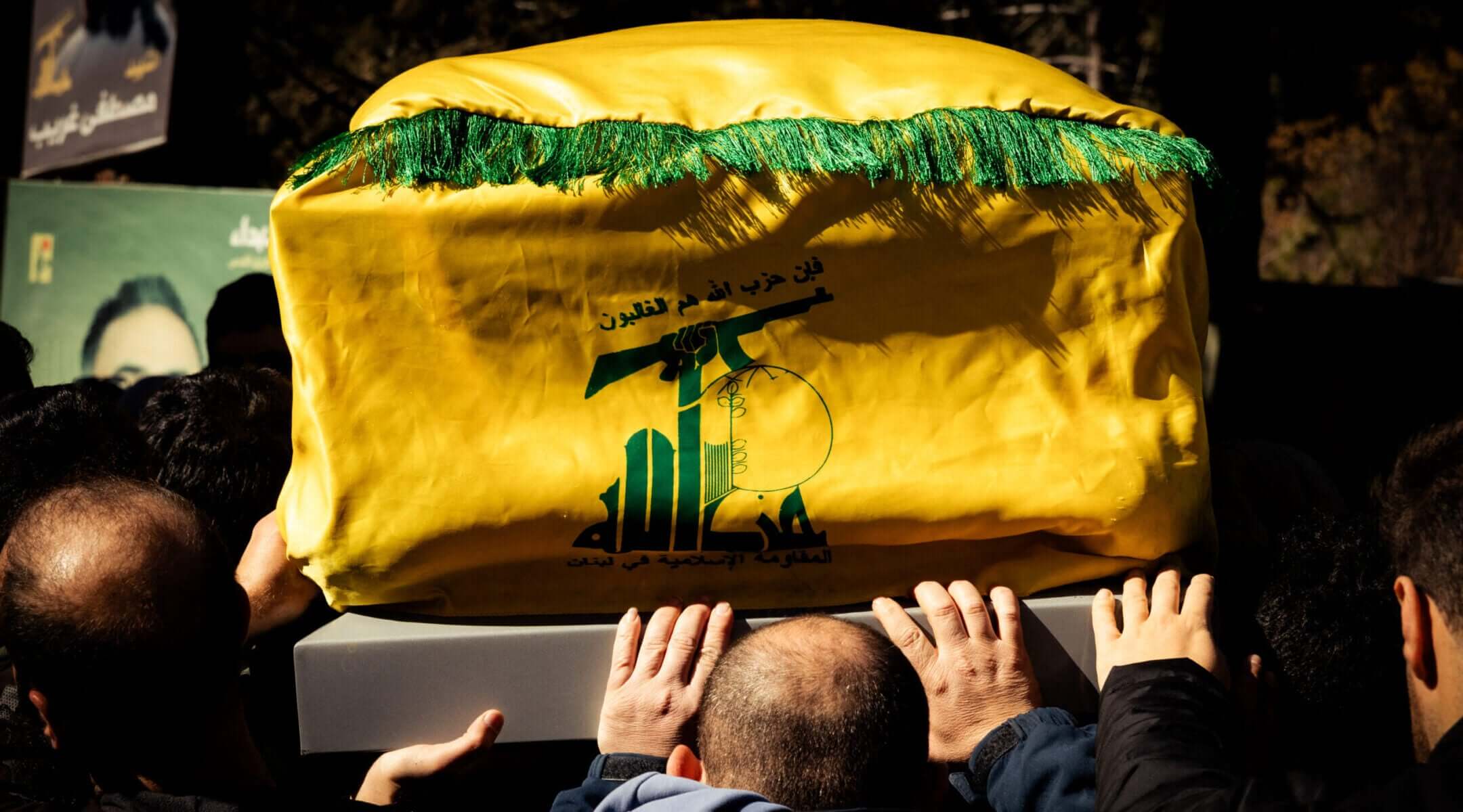 Men carry a coffin draped in a Hezbollah flag during a funeral of those killed in Israeli airstrikes in eastern Lebanon on March 5, 2026.