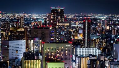 Characters standing on a battlefield in Marvel Stike Force with its logo and 'CODES' text displayed over it.