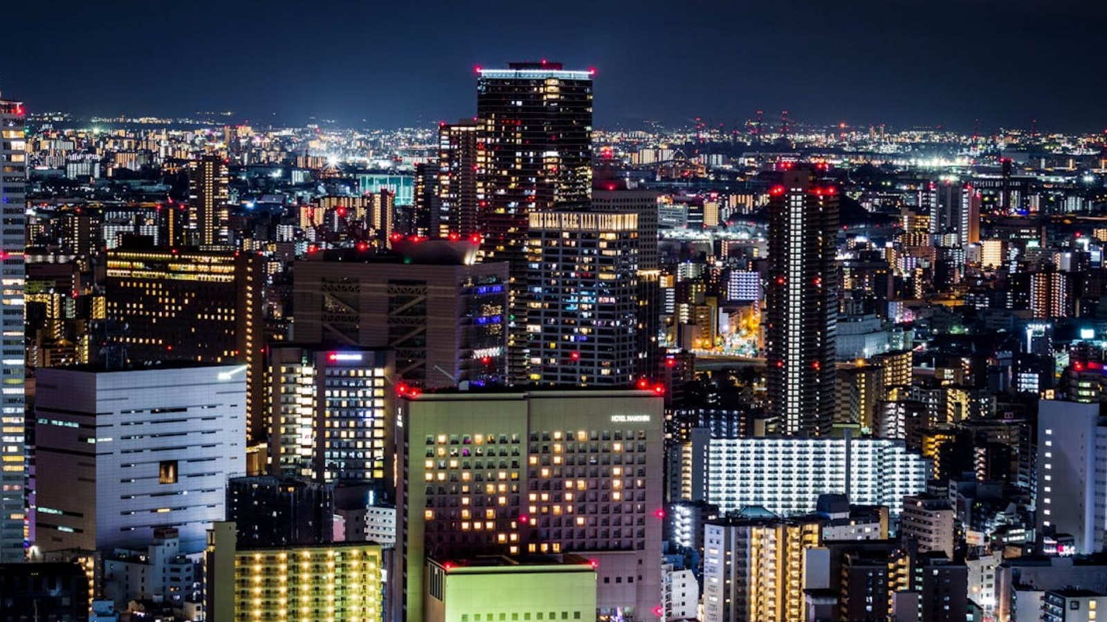 Characters standing on a battlefield in Marvel Stike Force with its logo and 'CODES' text displayed over it.